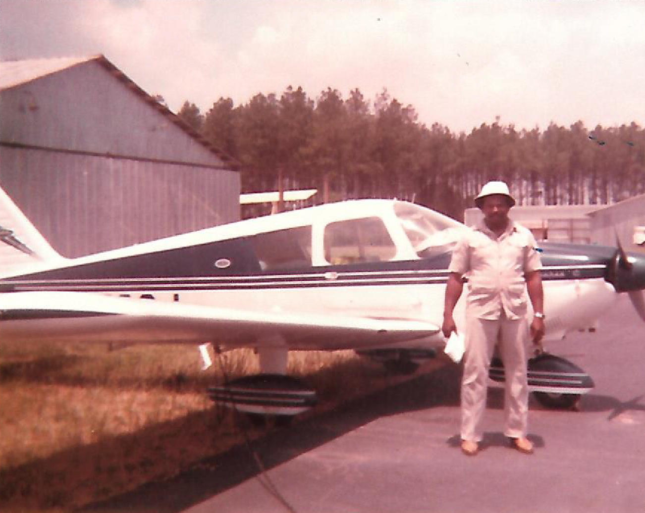 Carl Singletary in front a plane